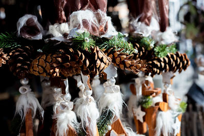 Close-up of christmas decorations hanging at market stall