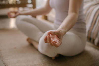 Midsection of woman holding hands