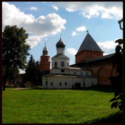 Facade of church against cloudy sky