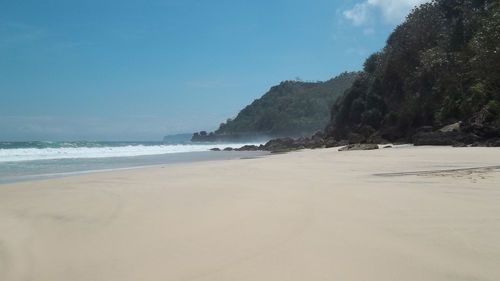 Scenic view of beach against clear sky