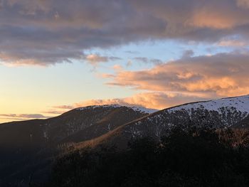 Scenic view of mountains against sky during sunset