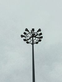 Low angle view of floodlight against sky