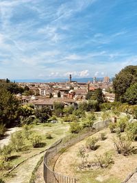 Panoramic view of trees and buildings against sky