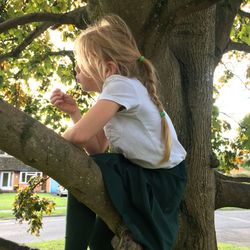 Full length of woman with tree against plants