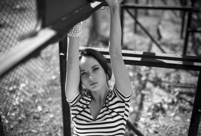 Portrait of young woman standing outdoors