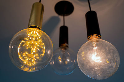 Low angle view of illuminated light bulb