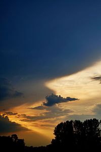 Silhouette of trees against sky at sunset