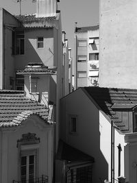 Houses against sky in city