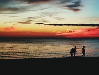 Silhouette of person standing on beach