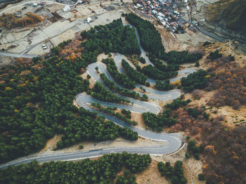 High angle view of road amidst trees in city