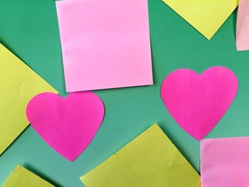 Close-up of heart shape on multi colored paper