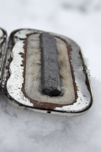 High angle view of rusty metal on snow