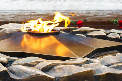 Close-up of burning fire on beach