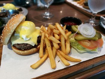 Close-up of burger and vegetables on table