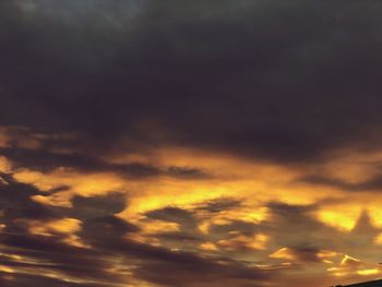 Low angle view of cloudy sky during sunset