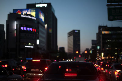 Traffic on city street during dusk