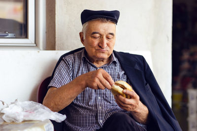 Midsection of man holding ice cream