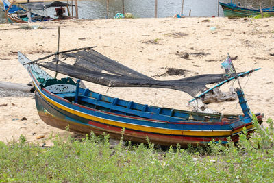 High angle view of abandoned boat moored on beach