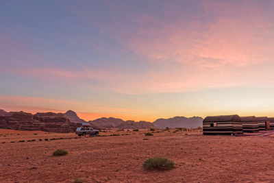Scenic view of landscape against cloudy sky