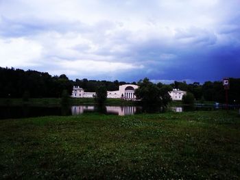 Built structure on field against sky