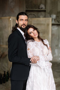 Portrait of couple standing outdoors