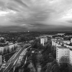 Cityscape against cloudy sky