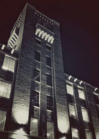 Low angle view of building against sky at night