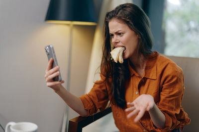 Young woman using mobile phone