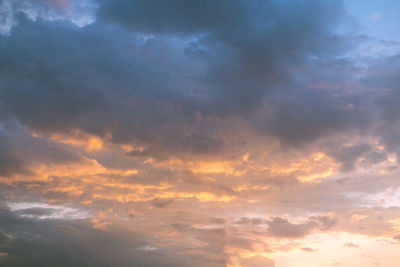 Low angle view of dramatic sky during sunset