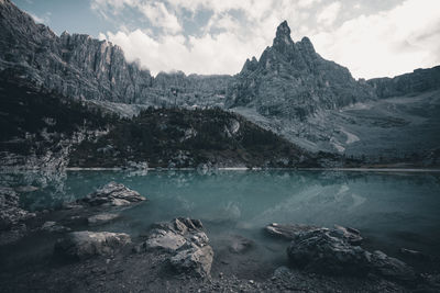 Scenic view of lake and mountains against sky