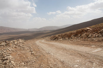 Dirt road passing through a desert