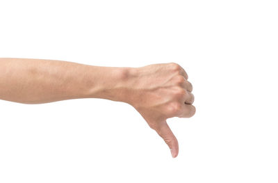 Close-up of hands against white background