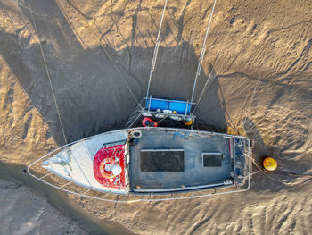 High angle view of ship on rock by sea