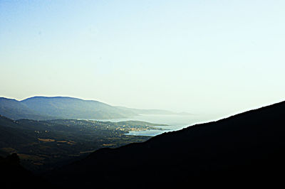 Scenic view of silhouette mountains against clear sky