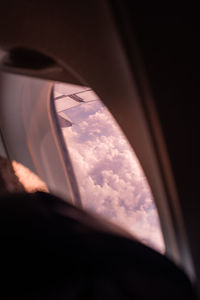 Low angle view of sky seen through car window