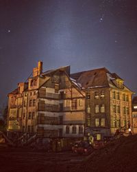 Buildings against sky at night