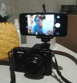 Woman photographing through camera