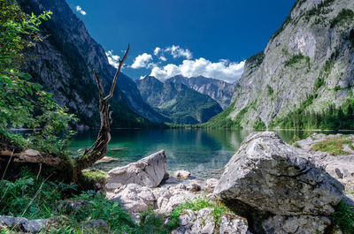 Scenic view of lake and mountains against sky