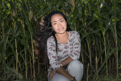 Portrait of smiling young woman on field