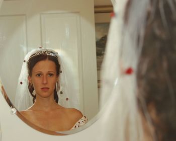 Reflection of beautiful bride in mirror