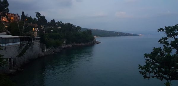 Scenic view of sea against sky at dusk