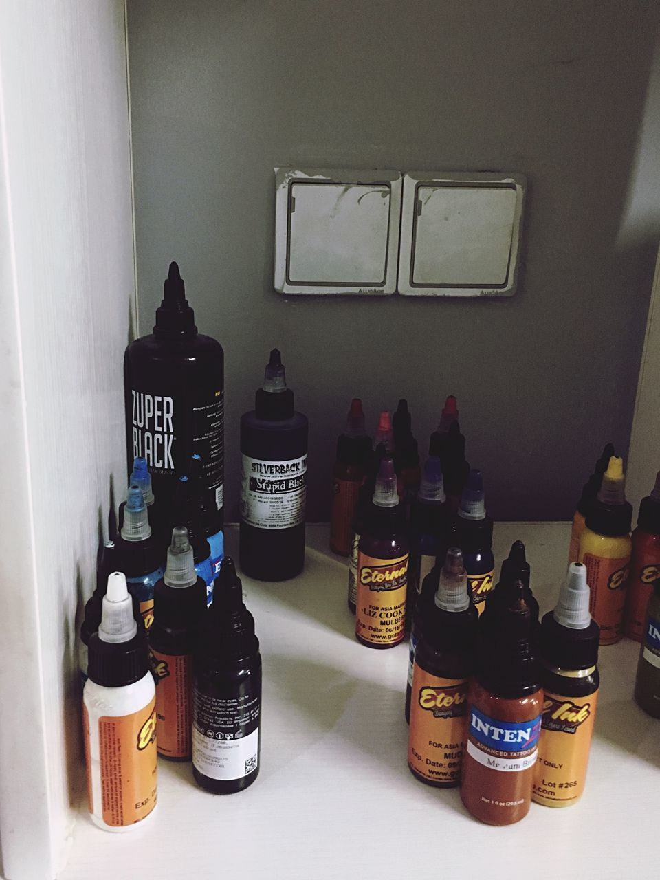 VIEW OF WINE BOTTLES ON TABLE