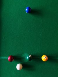 Close-up of multi colored pool balls on table