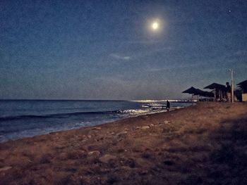 Scenic view of sea against sky at night