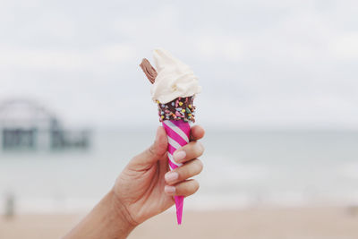 Hand holding ice cream cone