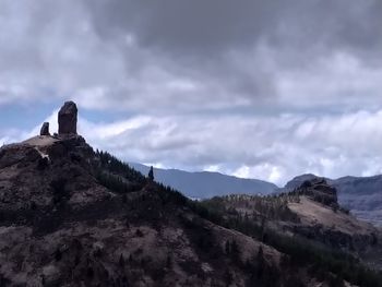 Rock formations on mountain against sky