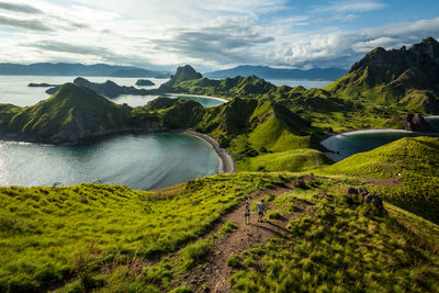 Scenic view of landscape and mountains against sky