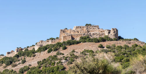 Low angle view of fort against blue sky