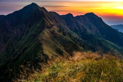 Scenic view of mountains against sky during sunset