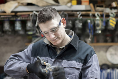 Plumber male working in a workshop